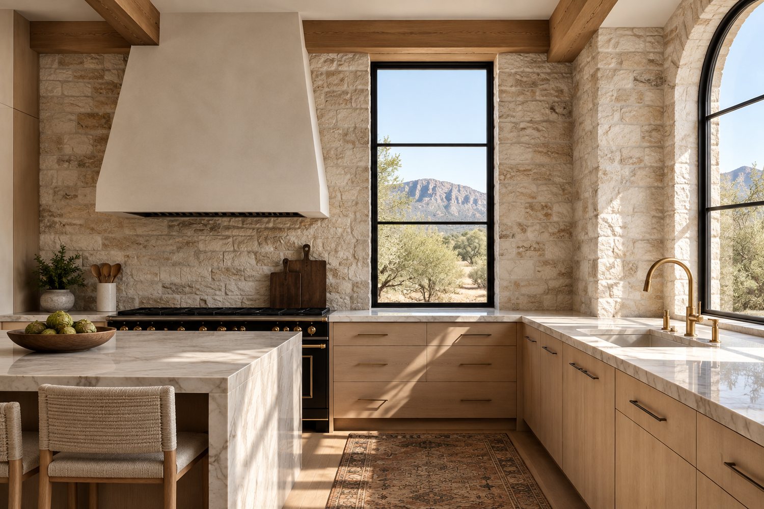 Designer chef kitchen with stone walls and mountain view
